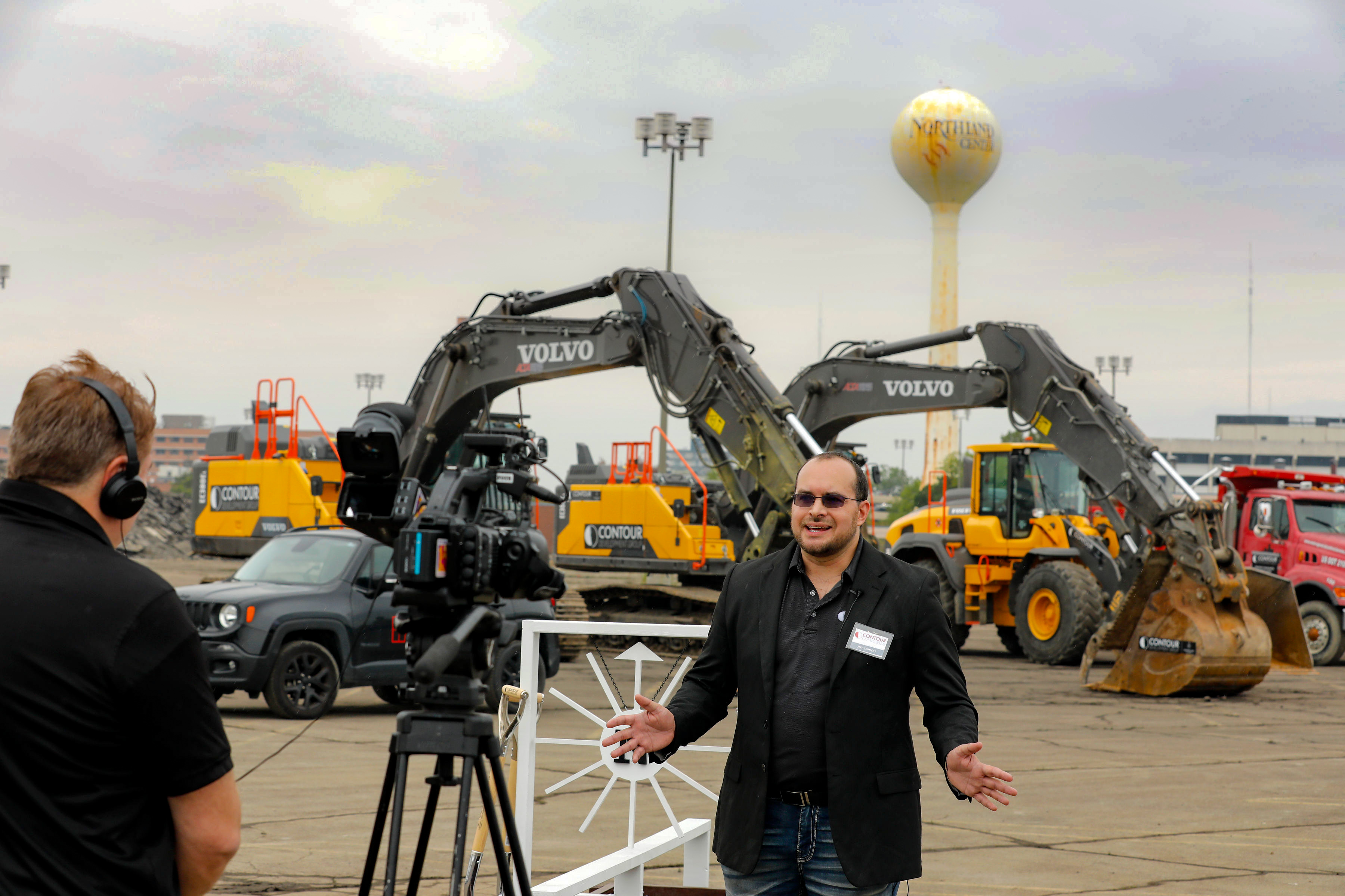 Jeff Schniers of The Studio Creative interviewed by a television crew at the Northland groundbreaking site