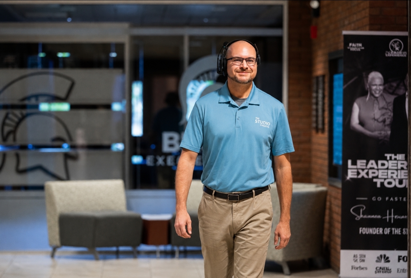 Jeff Schniers of The Studio Creative walking a venue in a headset before a conference broadcast