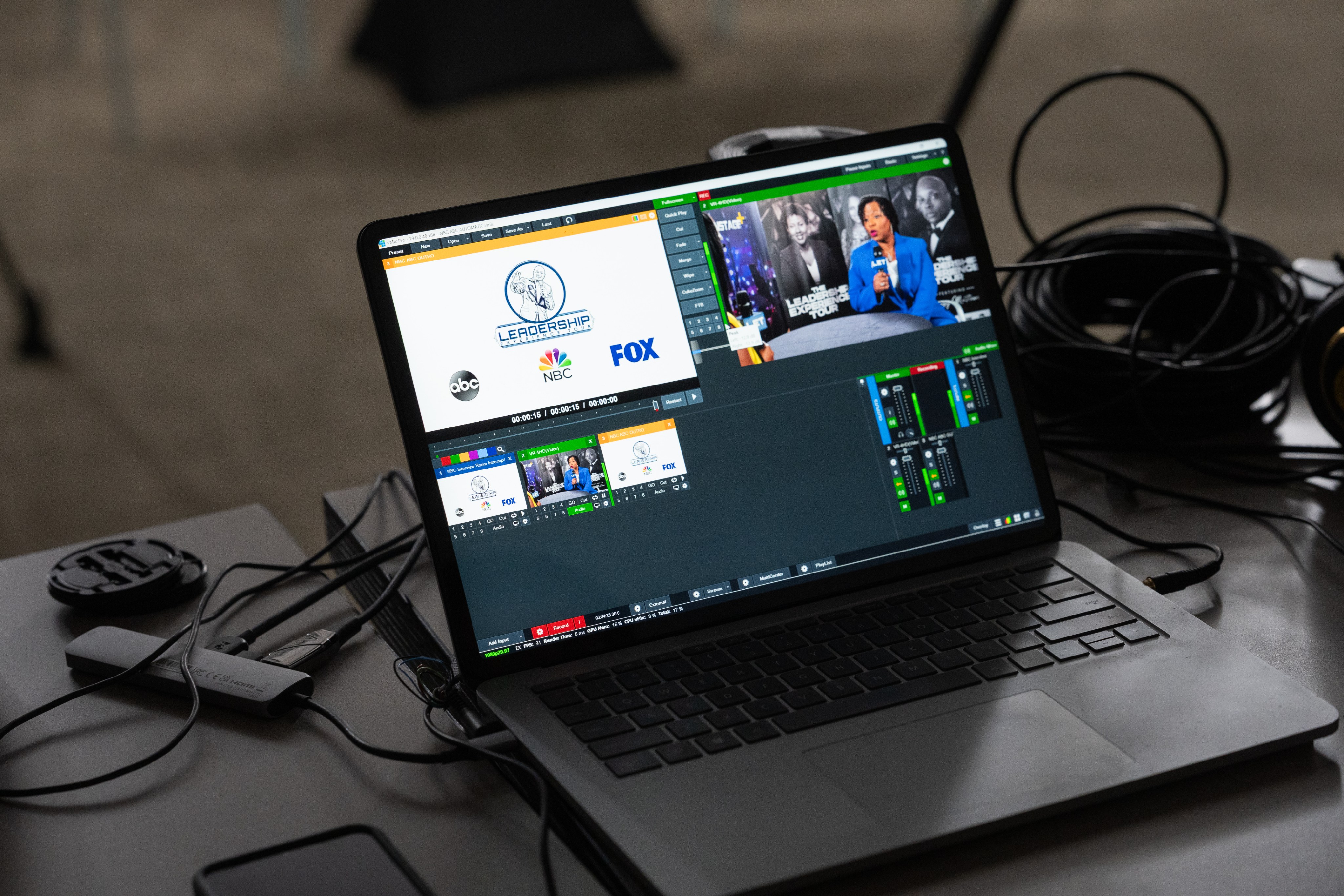A laptop running vMix with the live program and camera feeds from a Leadership Experience Tour broadcast