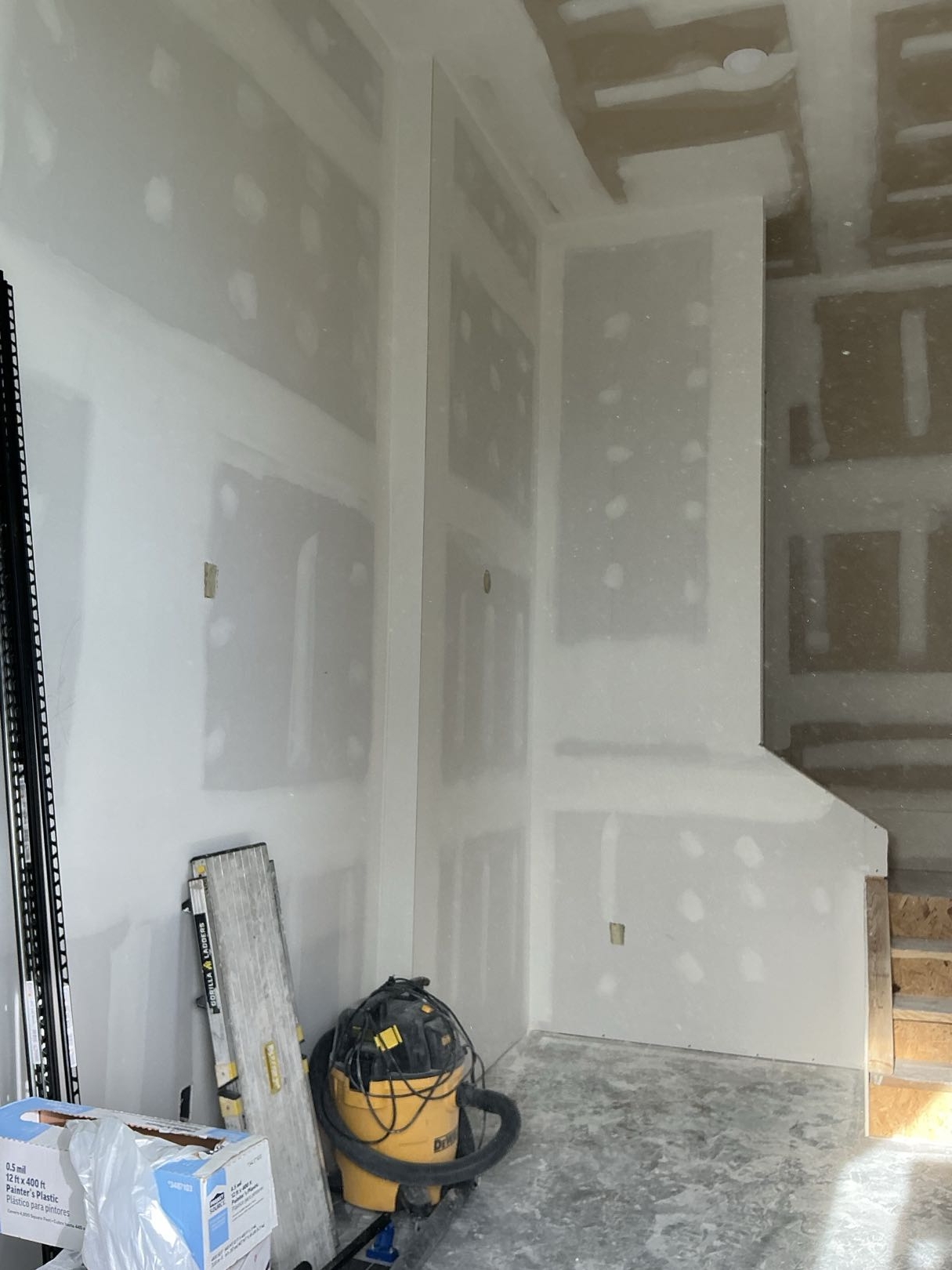 Before drywall repair showing damaged ceiling section