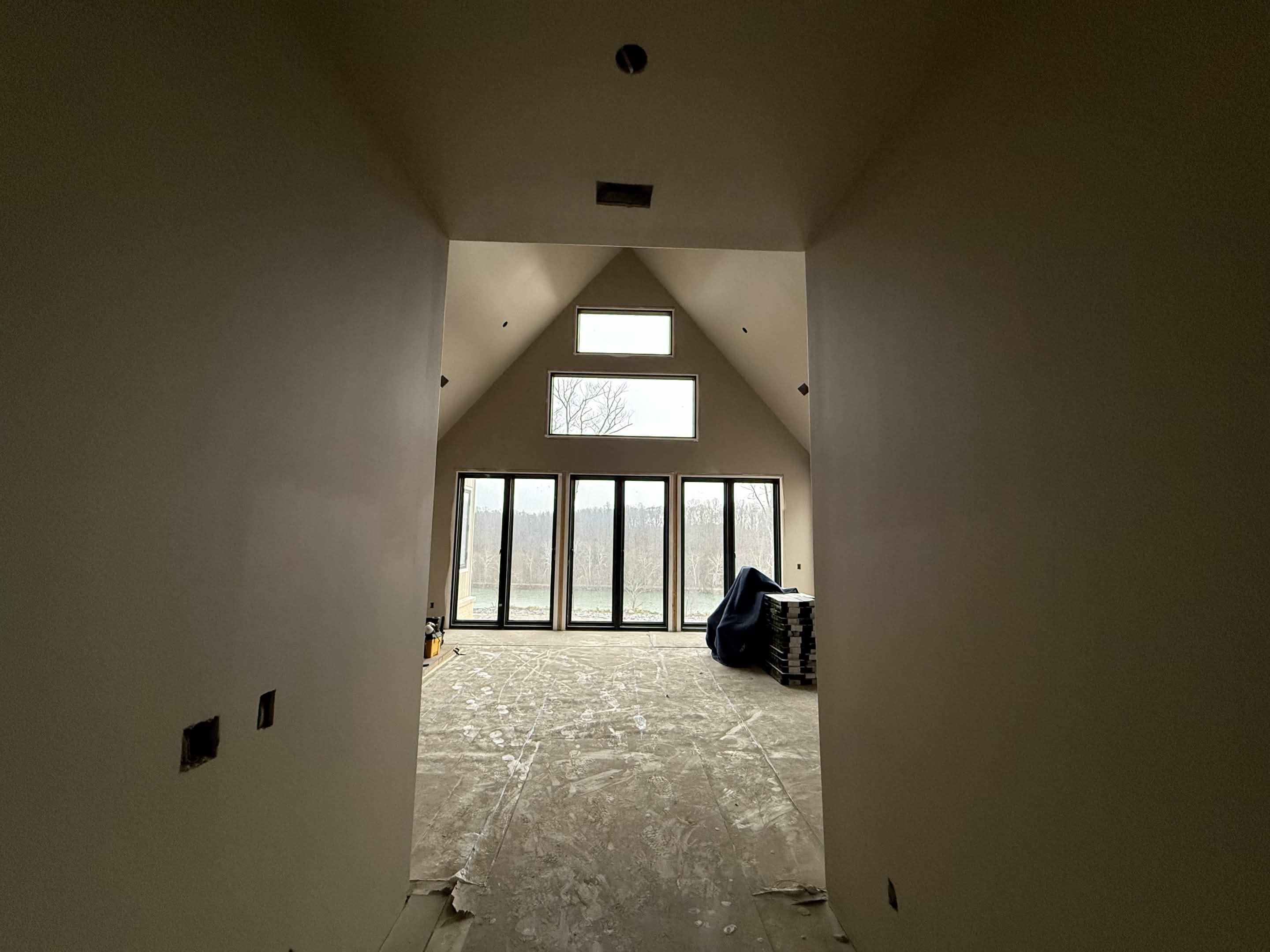 Completed drywall and paint finish with smooth, uniform wall and ceiling surfaces