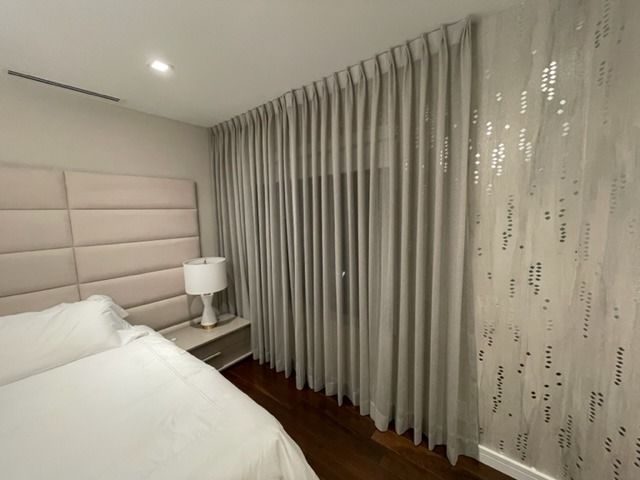 Custom drapery in a refined bedroom interior