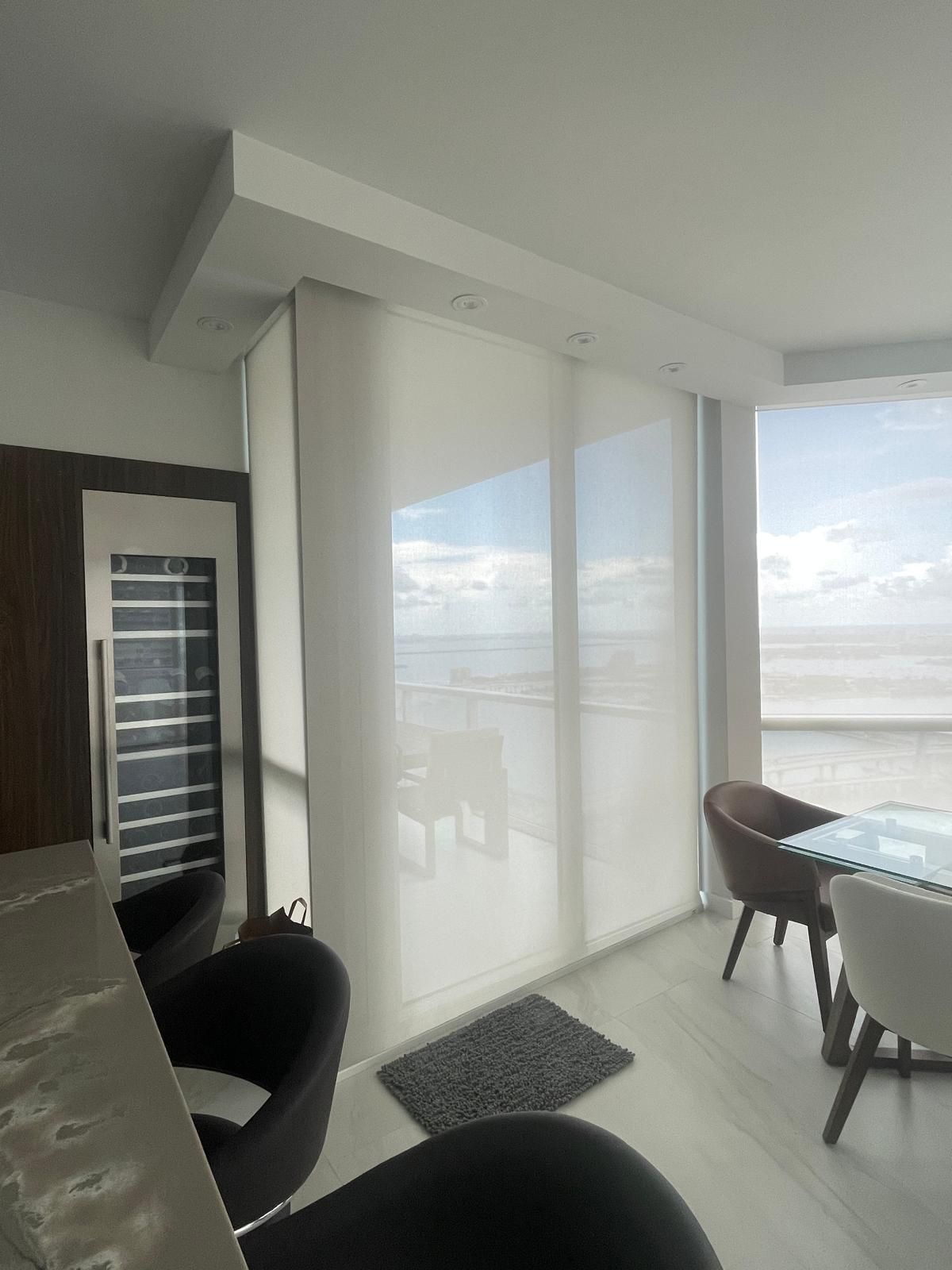 Floor-to-ceiling solar screen system