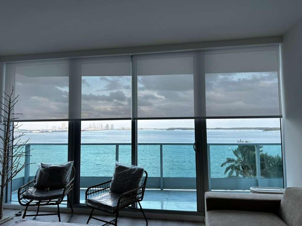 Motorized solar screen shades in contemporary interior