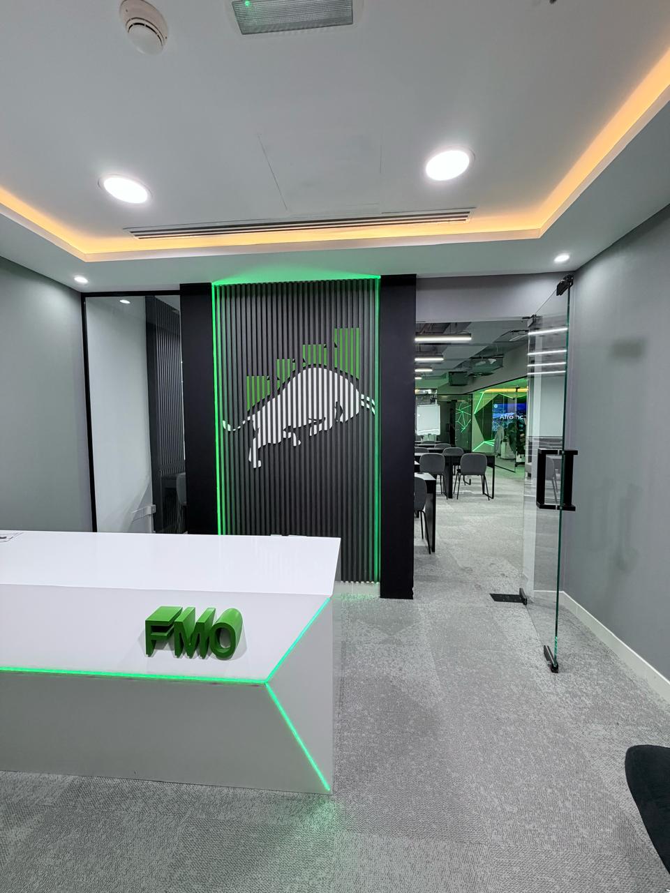 FMO reception desk with the bull logo wall