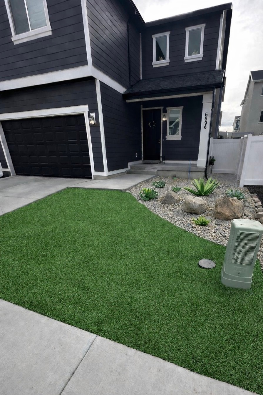 Front yard after: fresh turf and planting beds