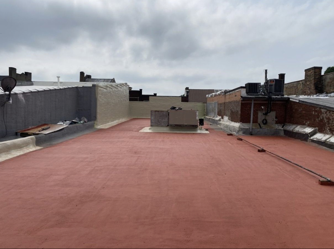 Aging asphaltic roof surface before restoration