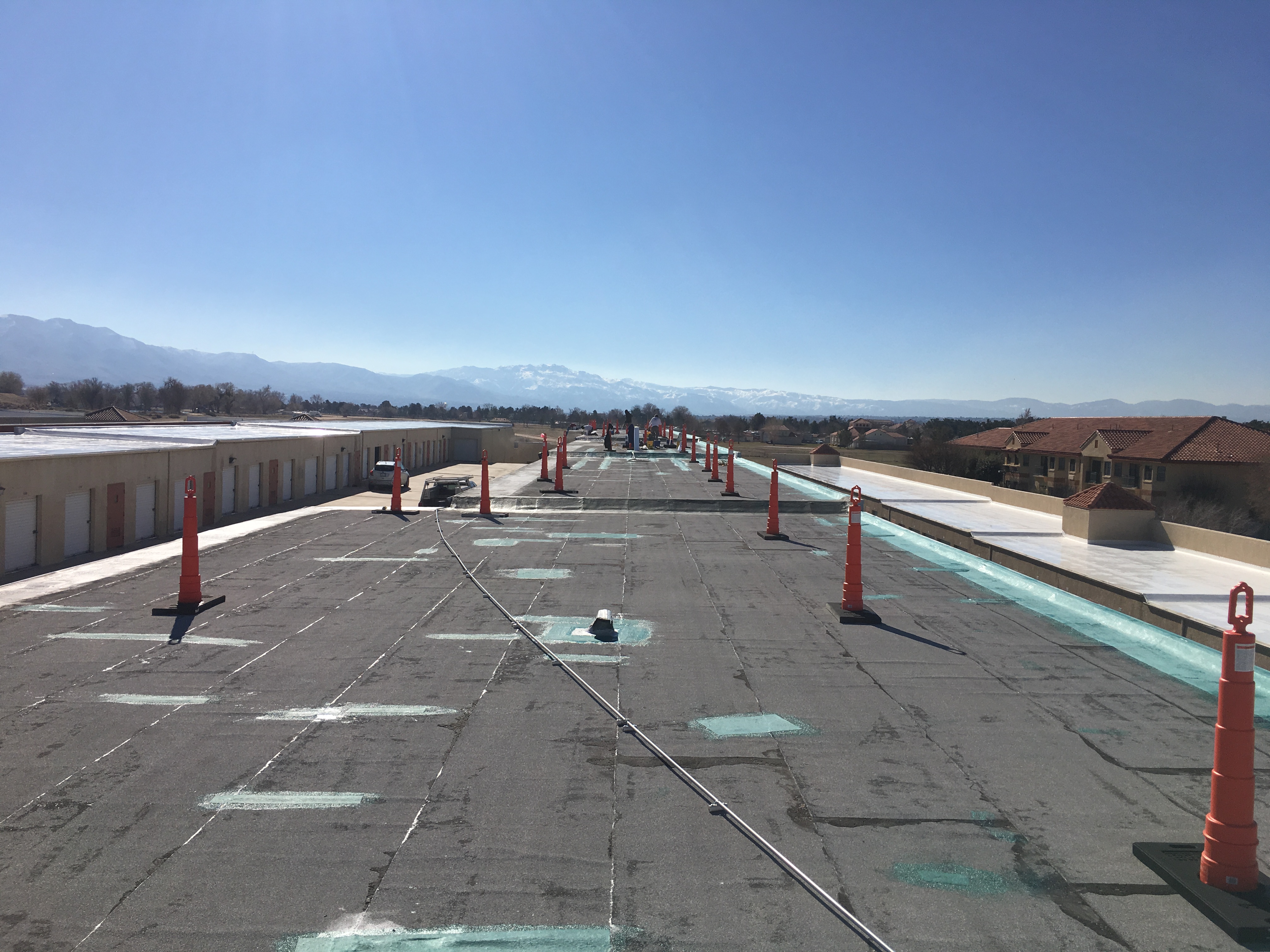 Long commercial roof run with safety cones