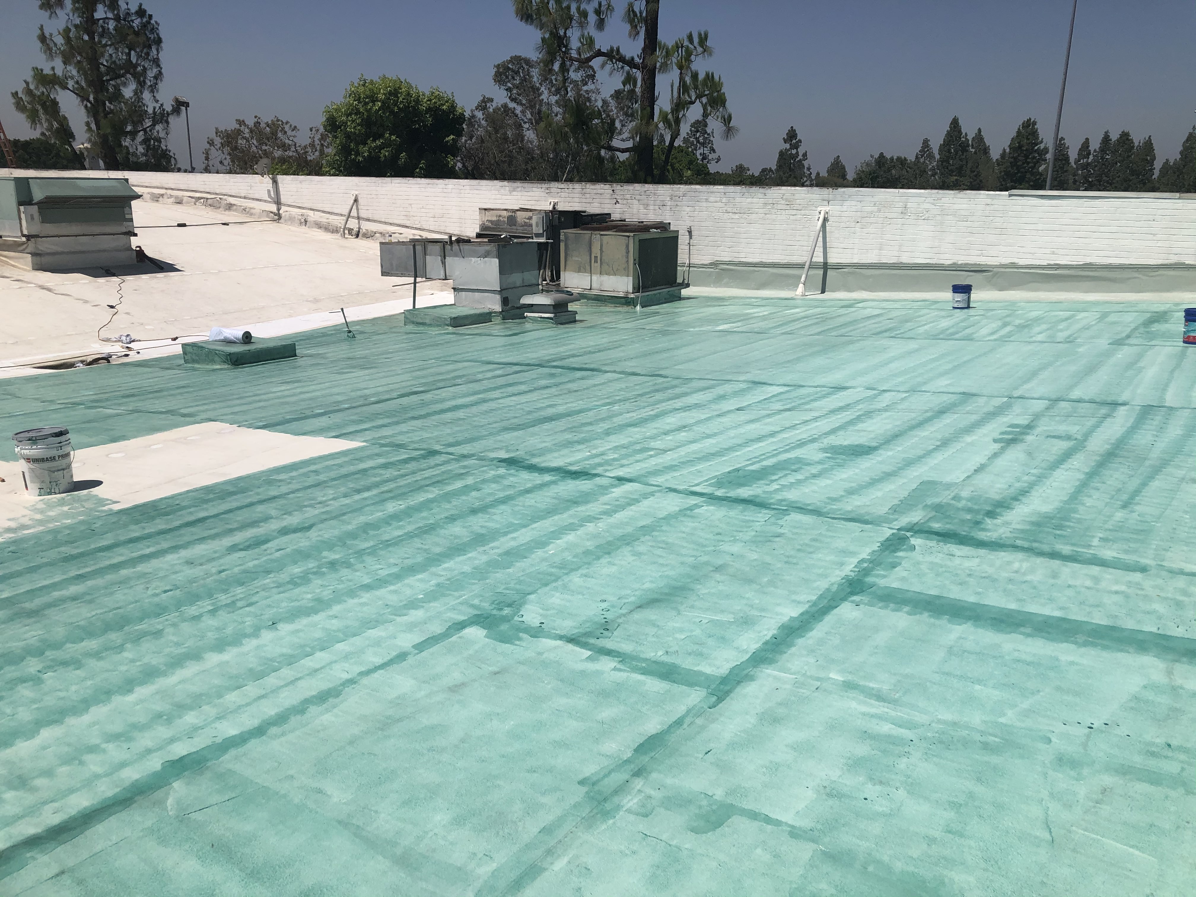 Restored coated commercial roof finish