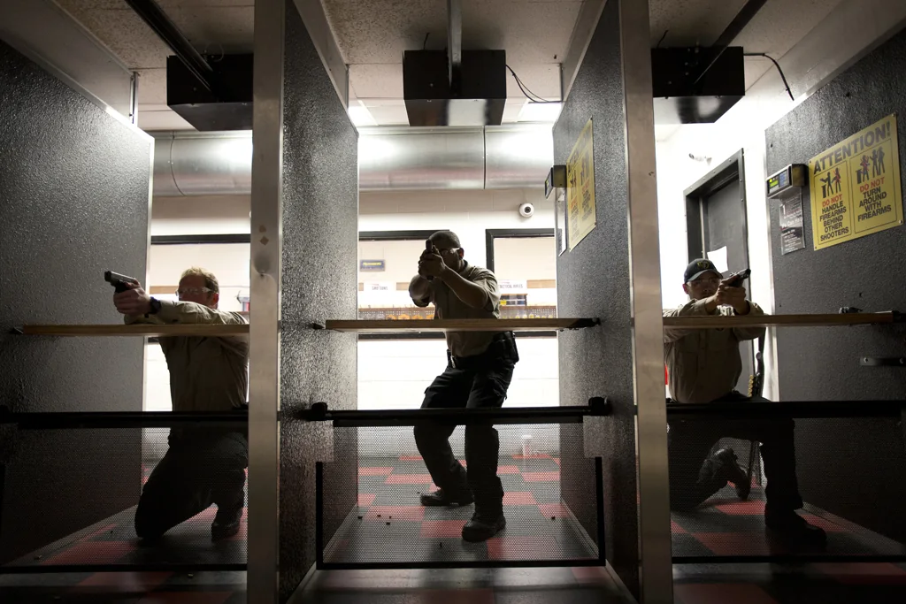 Instructor and participants during supervised firearms range training