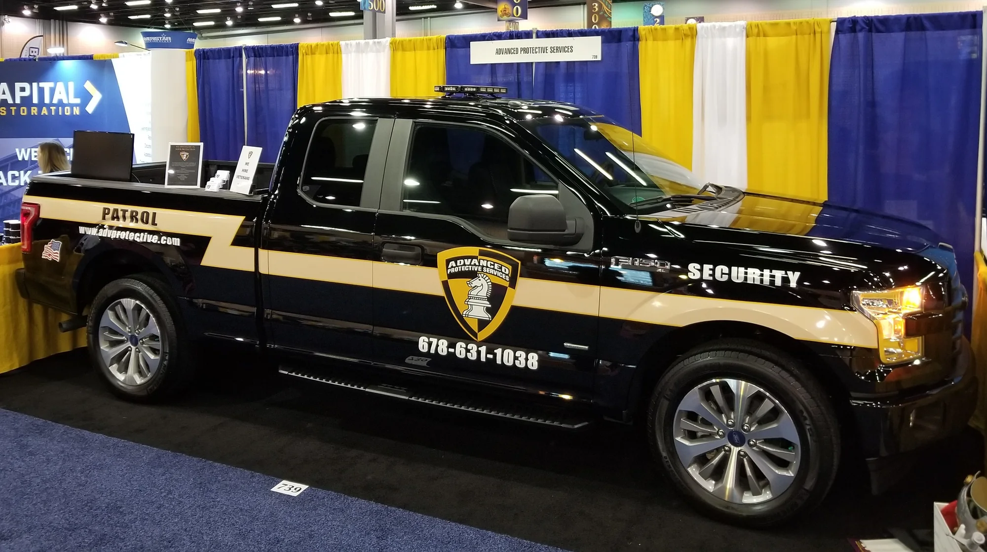 APS marked patrol truck on display