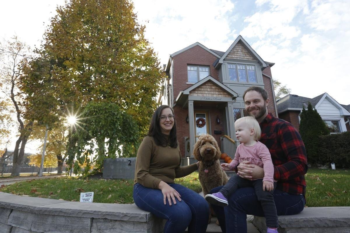 The Hadjis family in front of their completed East York home addition