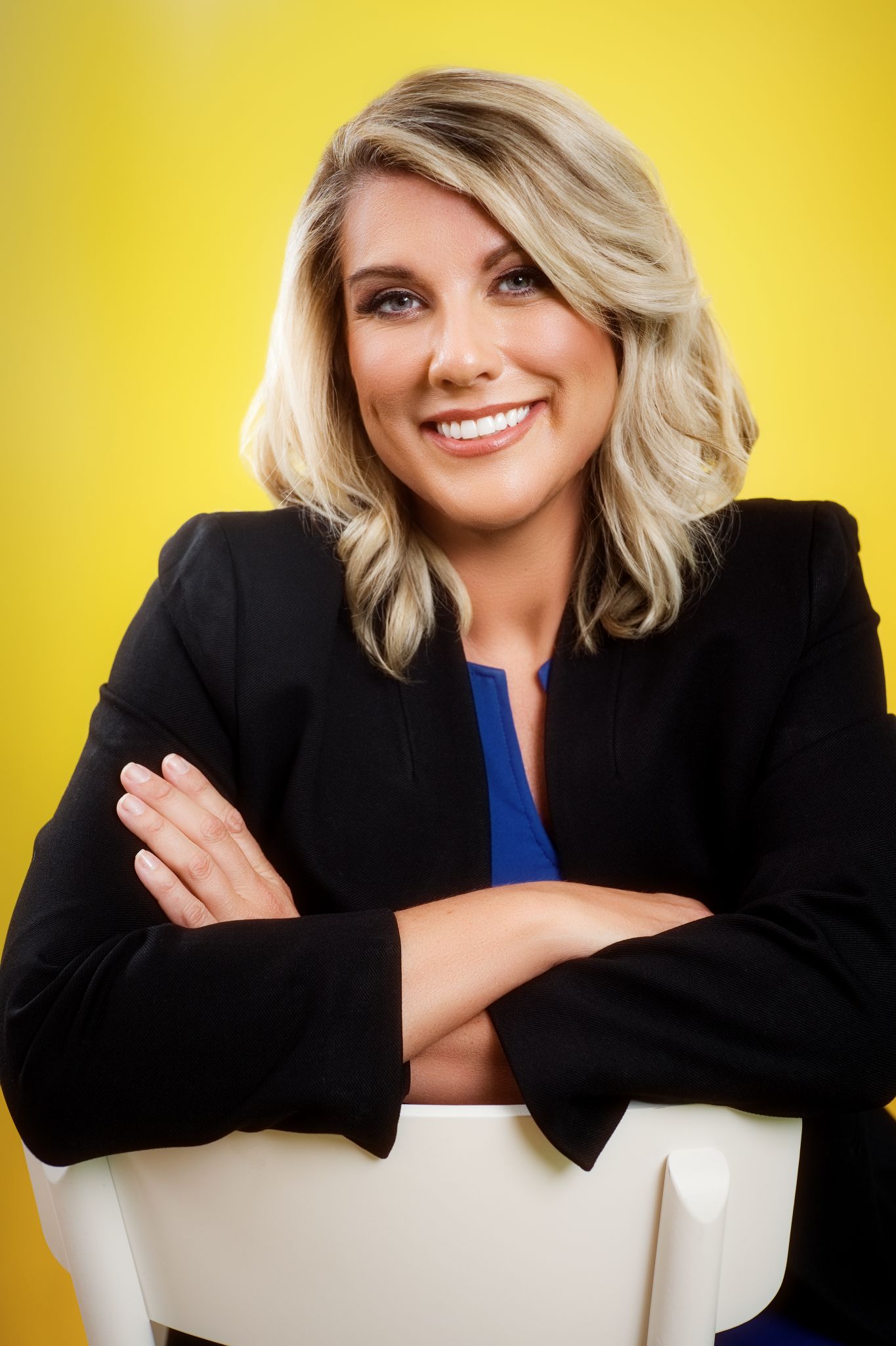Professional headshot of a Charleston female executive in a blazer, smiling confidently
