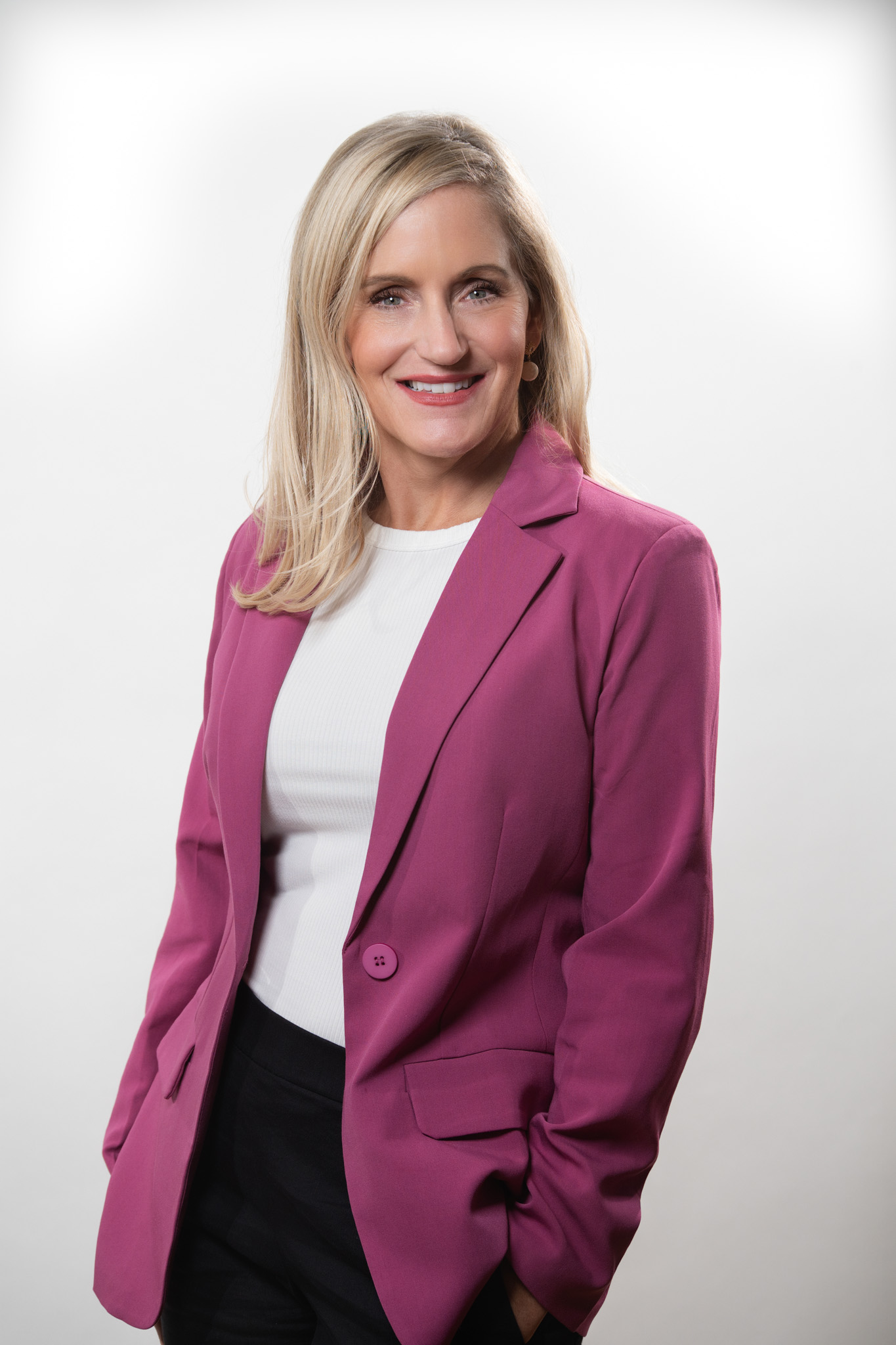 Elegant real estate headshot of a female agent in Charleston wearing a tailored black jacket