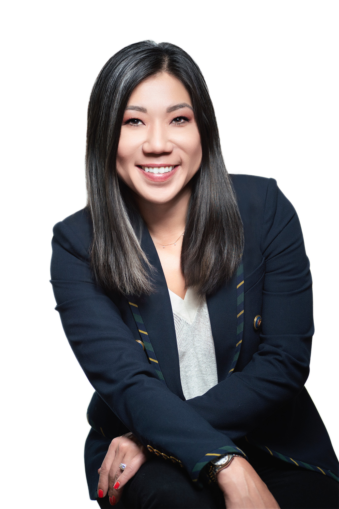 Elegant real estate headshot of a female agent in Charleston wearing a tailored black jacket