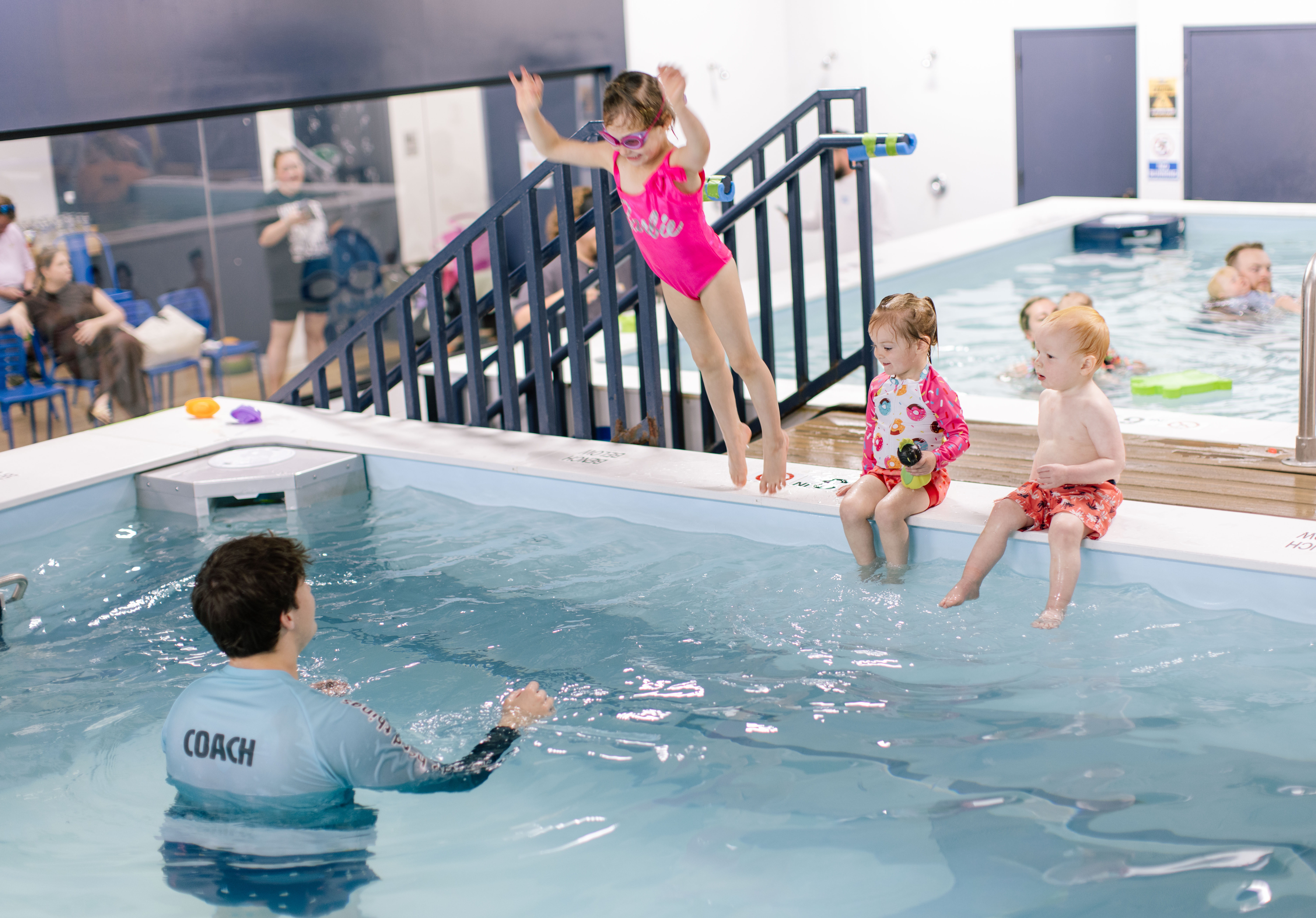 Student leaping confidently off the pool edge