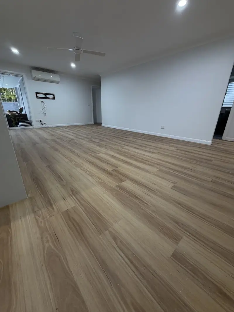 SPC hybrid flooring through an open living area with air conditioning