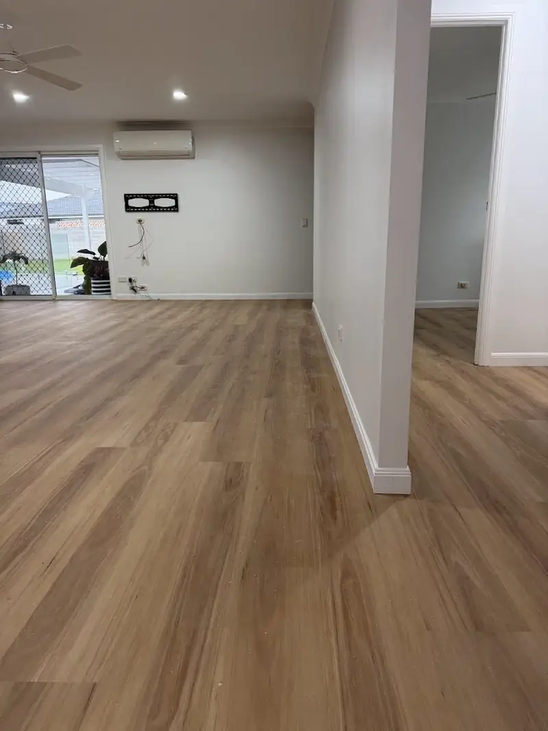 SPC hybrid flooring through a living and dining room