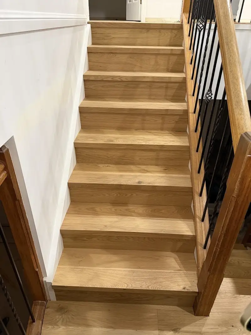 Engineered oak stair treads with black wire balustrade