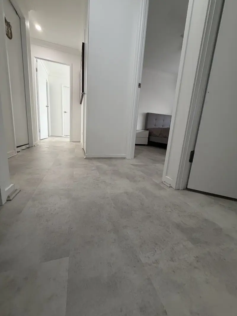 Stone-look SPC hybrid flooring in a hallway