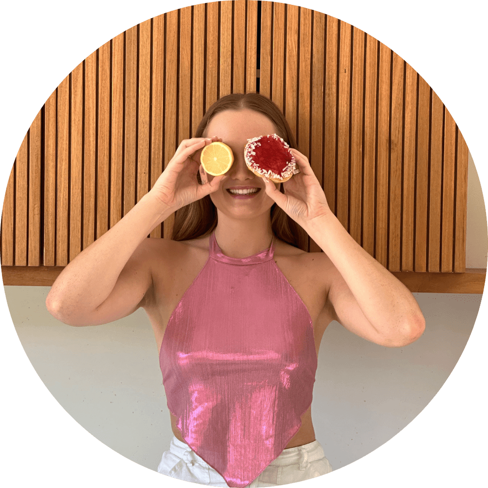 Mikaela Schifferle holding a lemon and a donut over her eyes