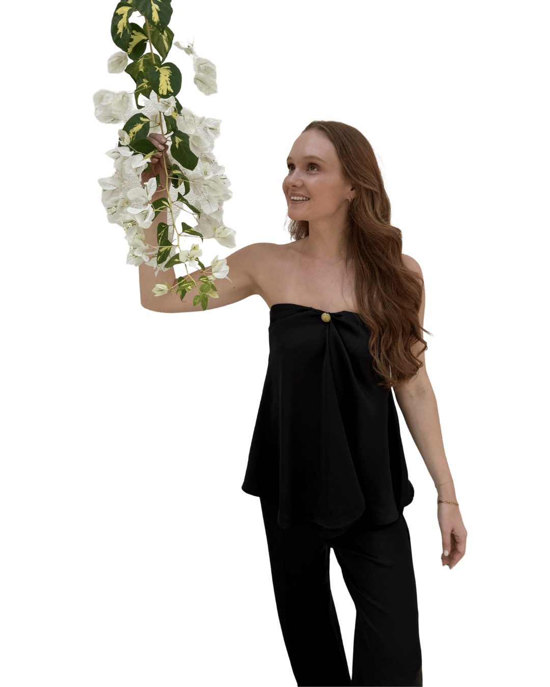 Mikaela holding a bunch of white flowers