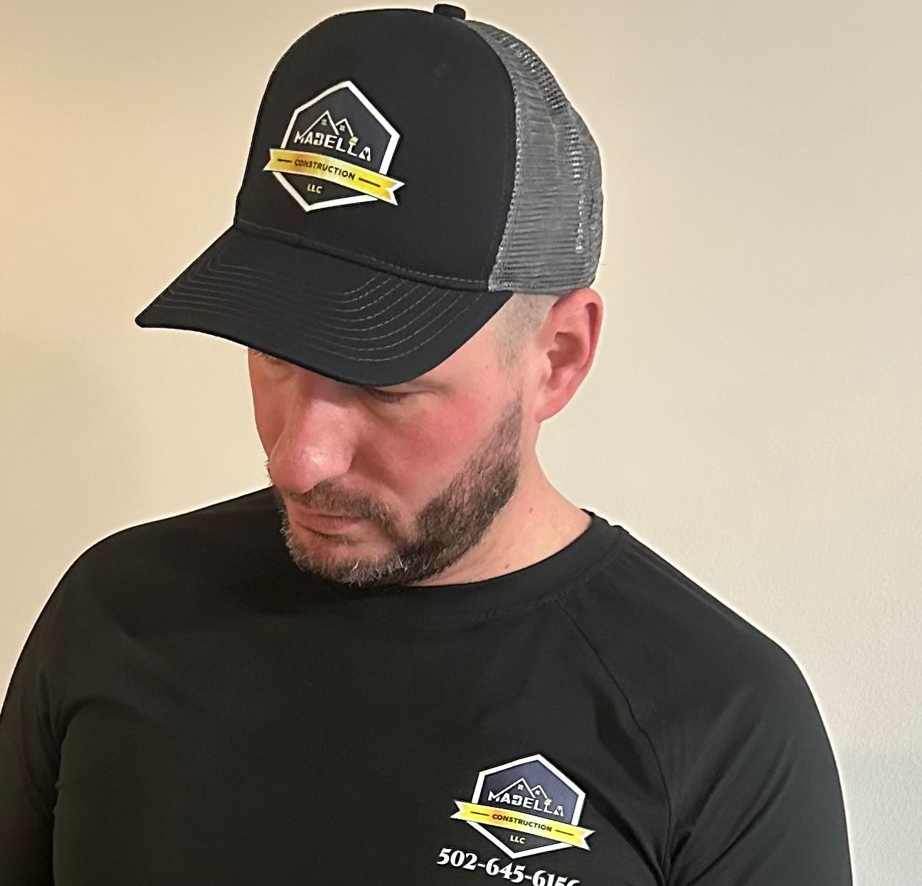 Marco A. Abella Perez, owner of Mabella Construction, wearing the Mabella cap
