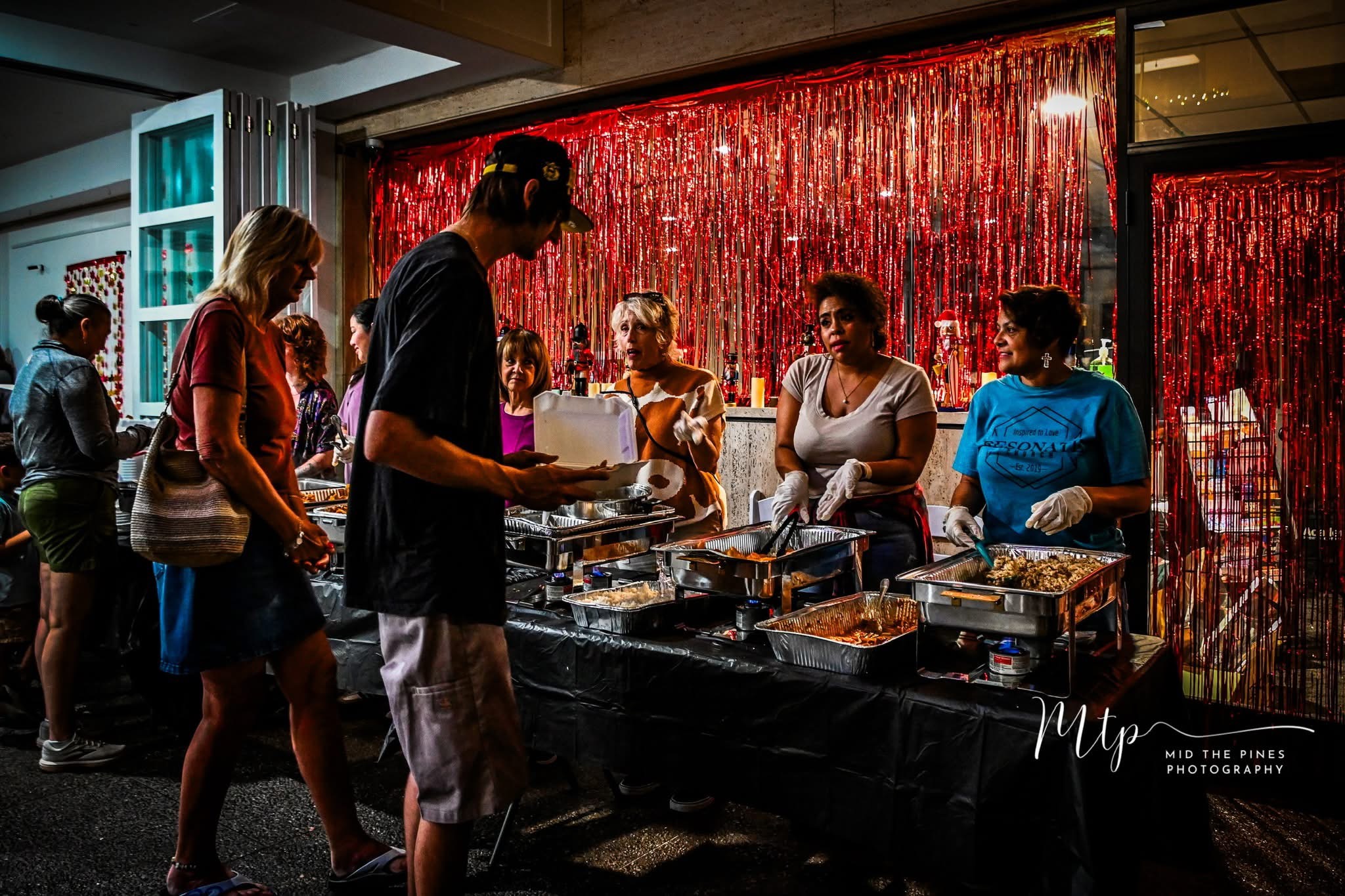 Volunteers serving at a MarMo community meal