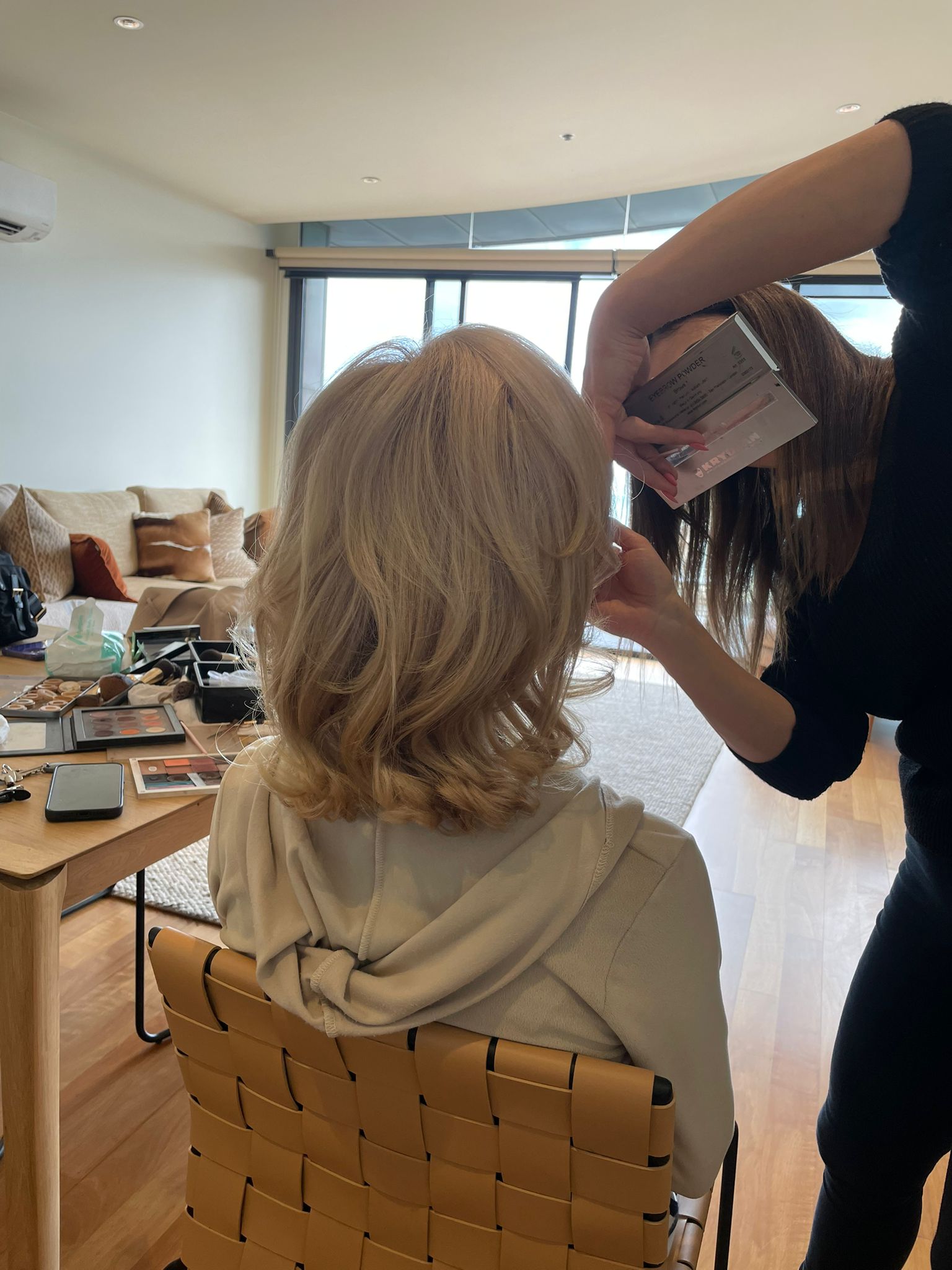 Brooke applying event makeup backstage