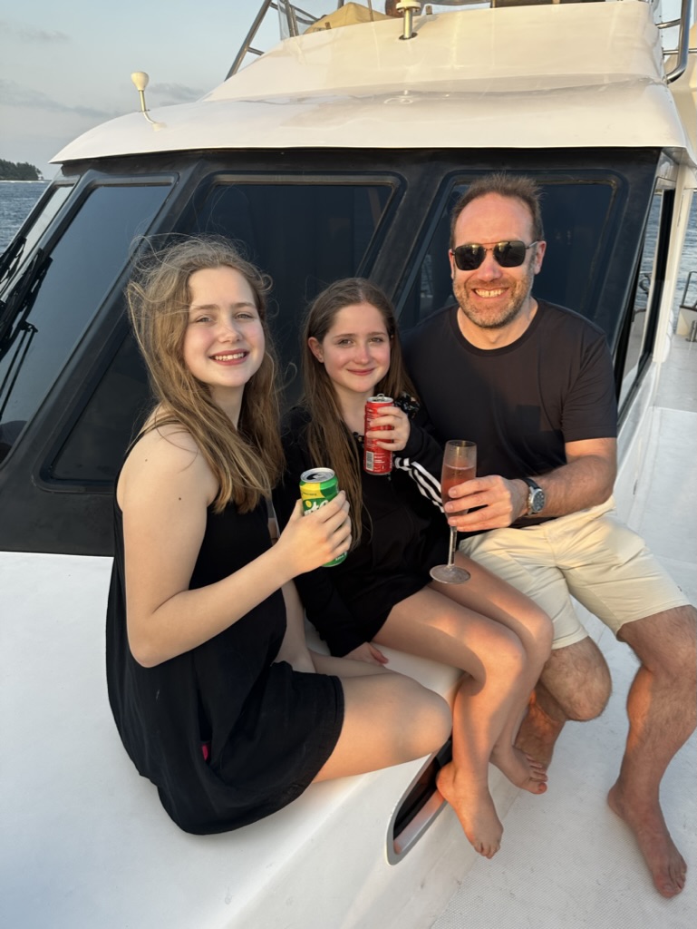 Andrew with his daughters