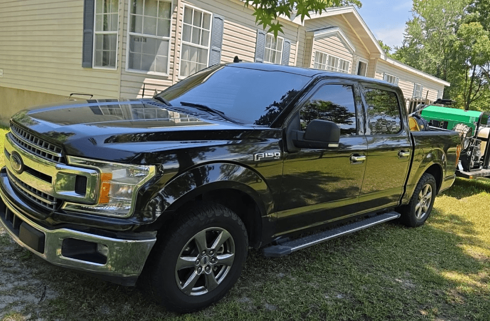 E&S Pressure Washing restoring a driveway in Jacksonville, FL