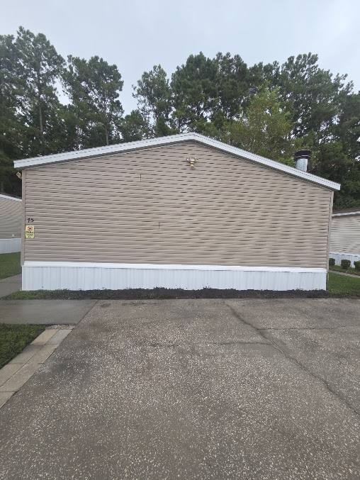 Cleaned concrete surface restored by E&S Pressure Washing in Nassau County