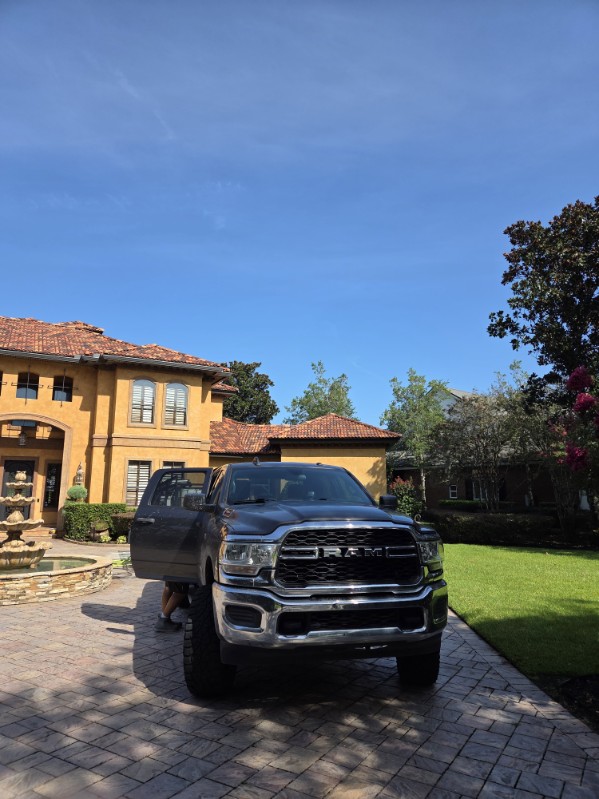 Brightened fence after professional washing in Jacksonville, FL