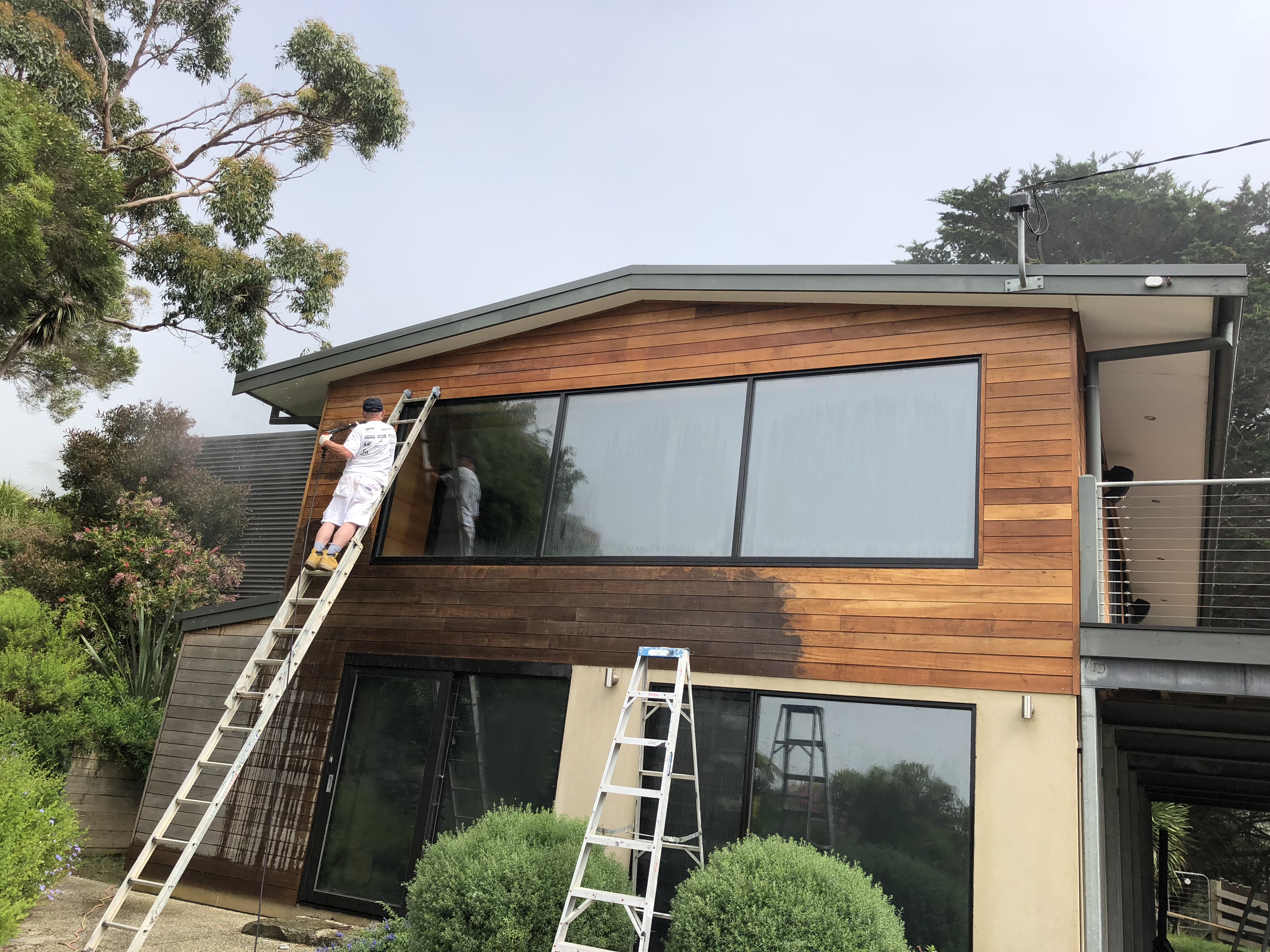 Weathered coastal timber home exterior awaiting restoration, a typical repaint specialist project for Magic Coatings in Melbourne