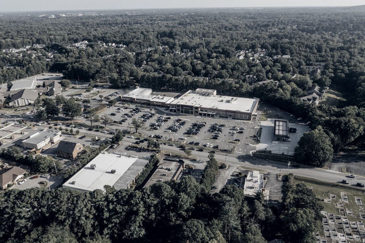 Aerial view of a suburban retail center and its parking lot