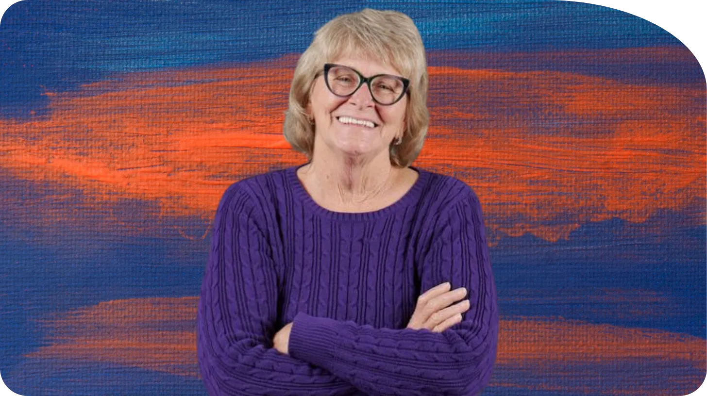 Nancy smiling warmly, representing mindfulness, compassion, and healing.