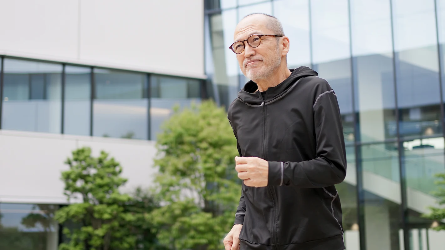 Older adult moving outdoors in a modern care environment