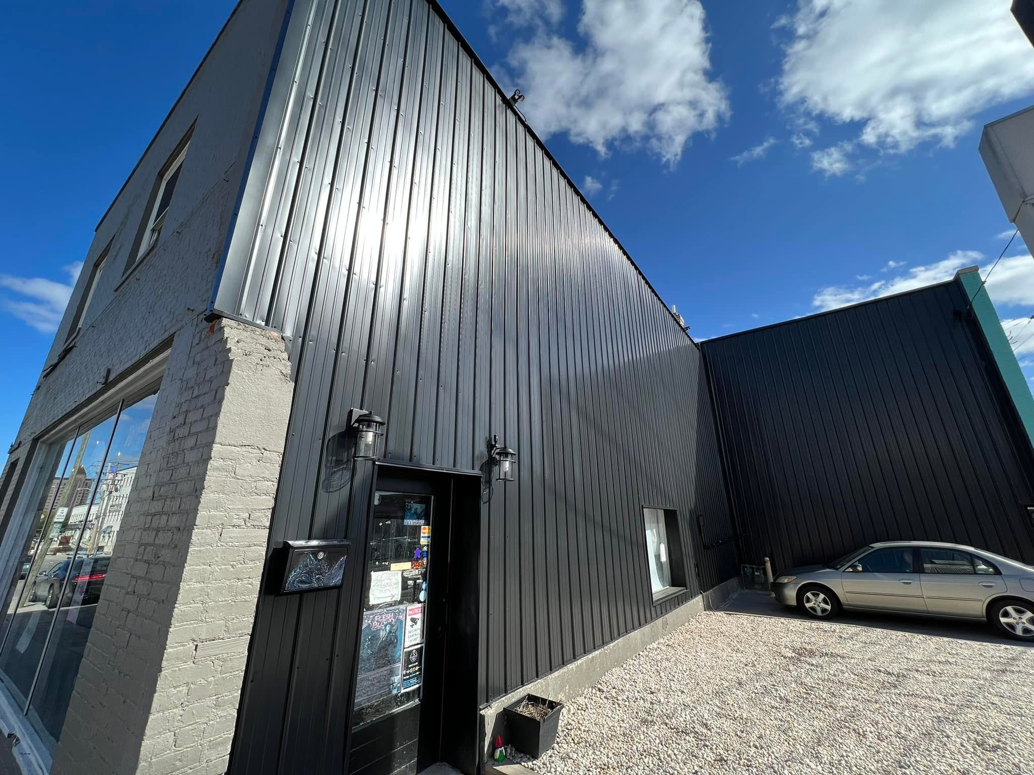 Commercial building exterior after metal siding renovation