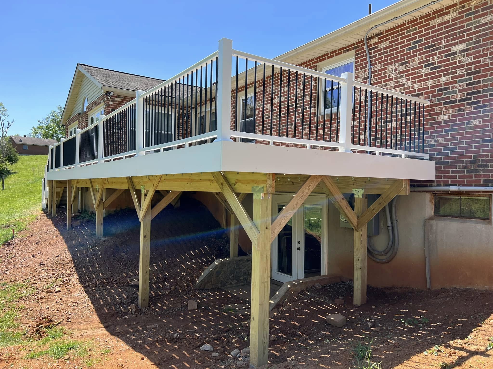 Completed elevated deck overlooking a wooded
property