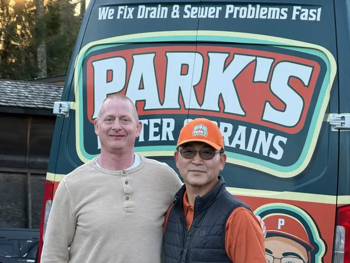 Park's Rooter & Drains technician with a happy customer