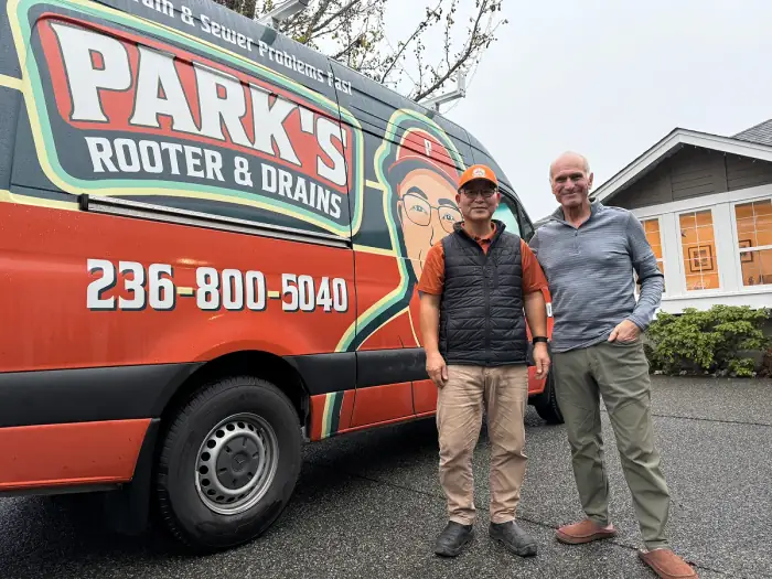 Park's Rooter & Drains technician with a happy customer