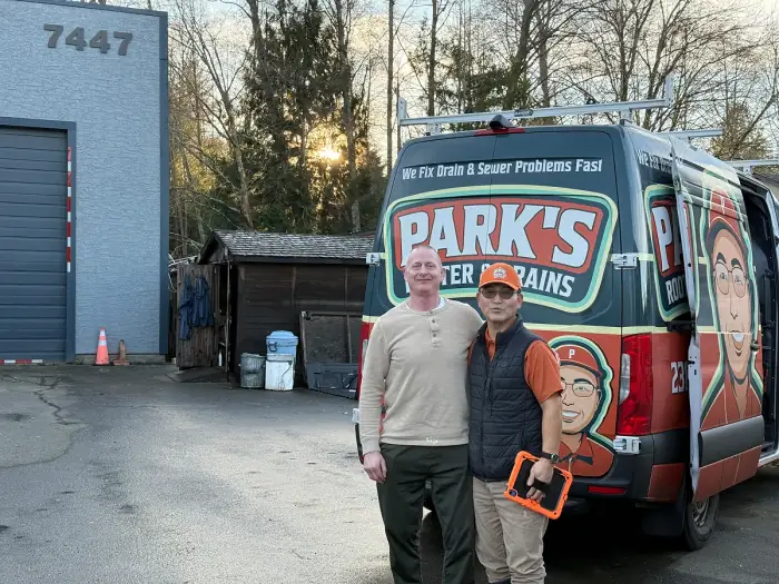 Park's Rooter & Drains technician with a happy customer