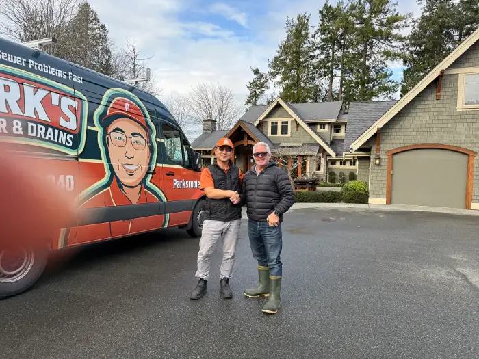 Park's Rooter & Drains technician with a happy customer