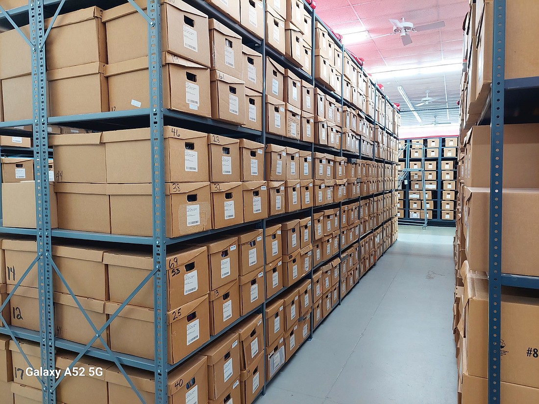 Rows of archived property records and files