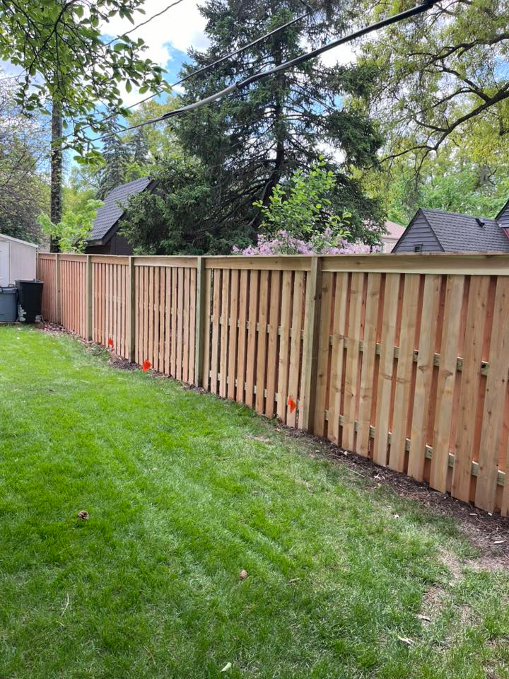 Wood shadowbox fence with mulch landscaping Lincoln NE