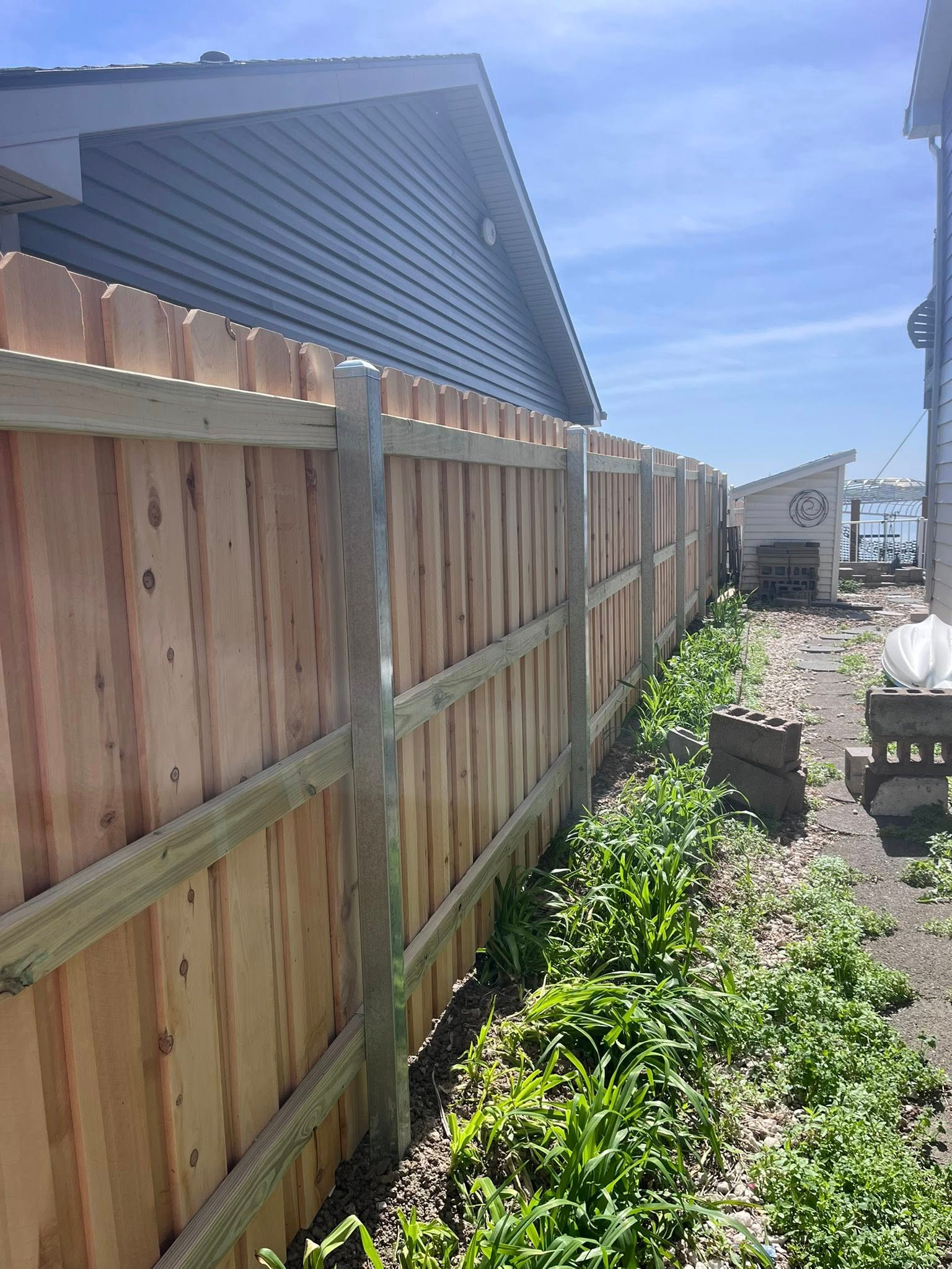 Cedar privacy fence with galvanized steel posts installed in Lincoln, NE by Rio Fence Co.
