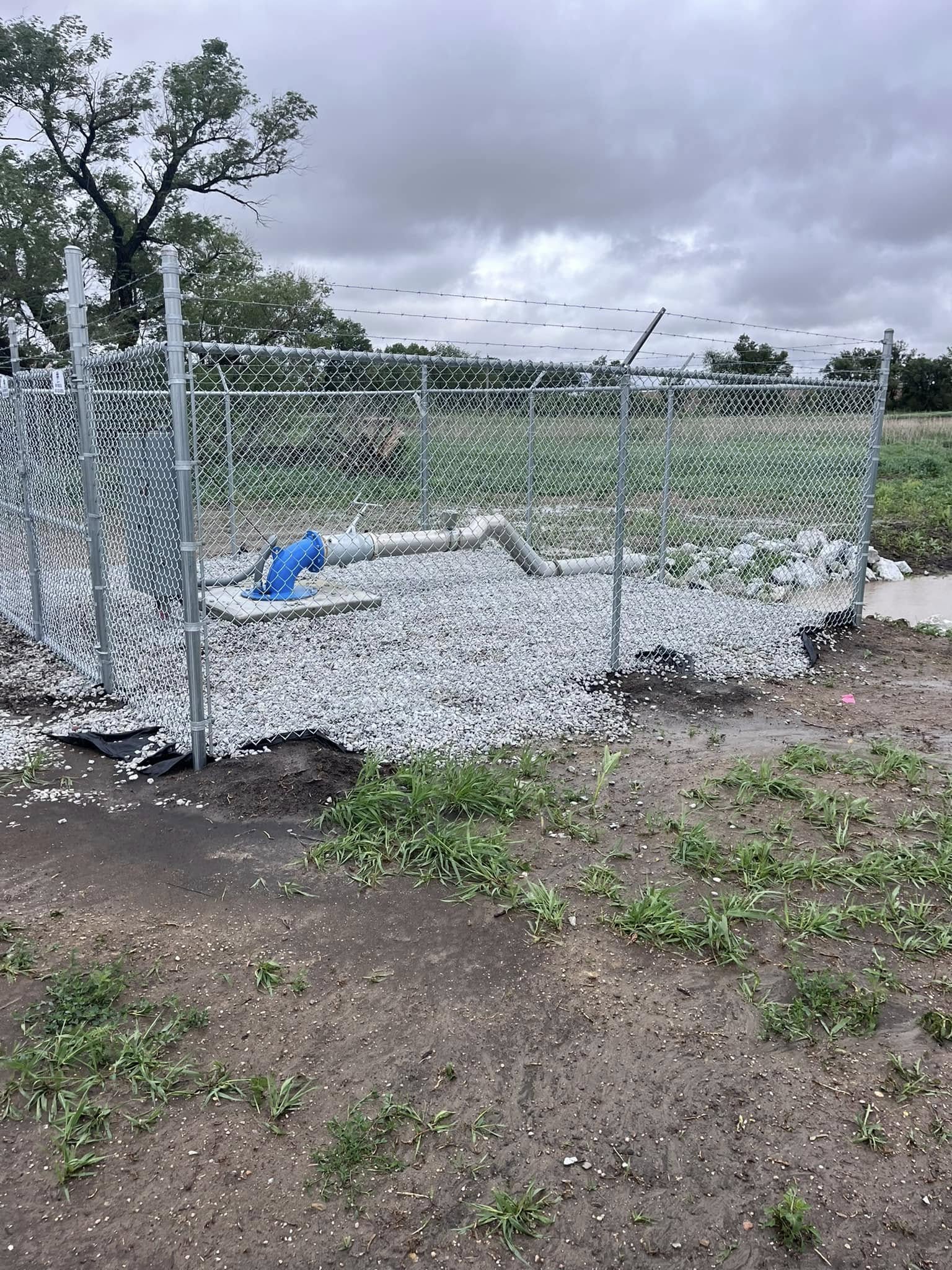 Industrial galvanized chain-link fence with barbed wire top Lincoln NE Rio Fence Co