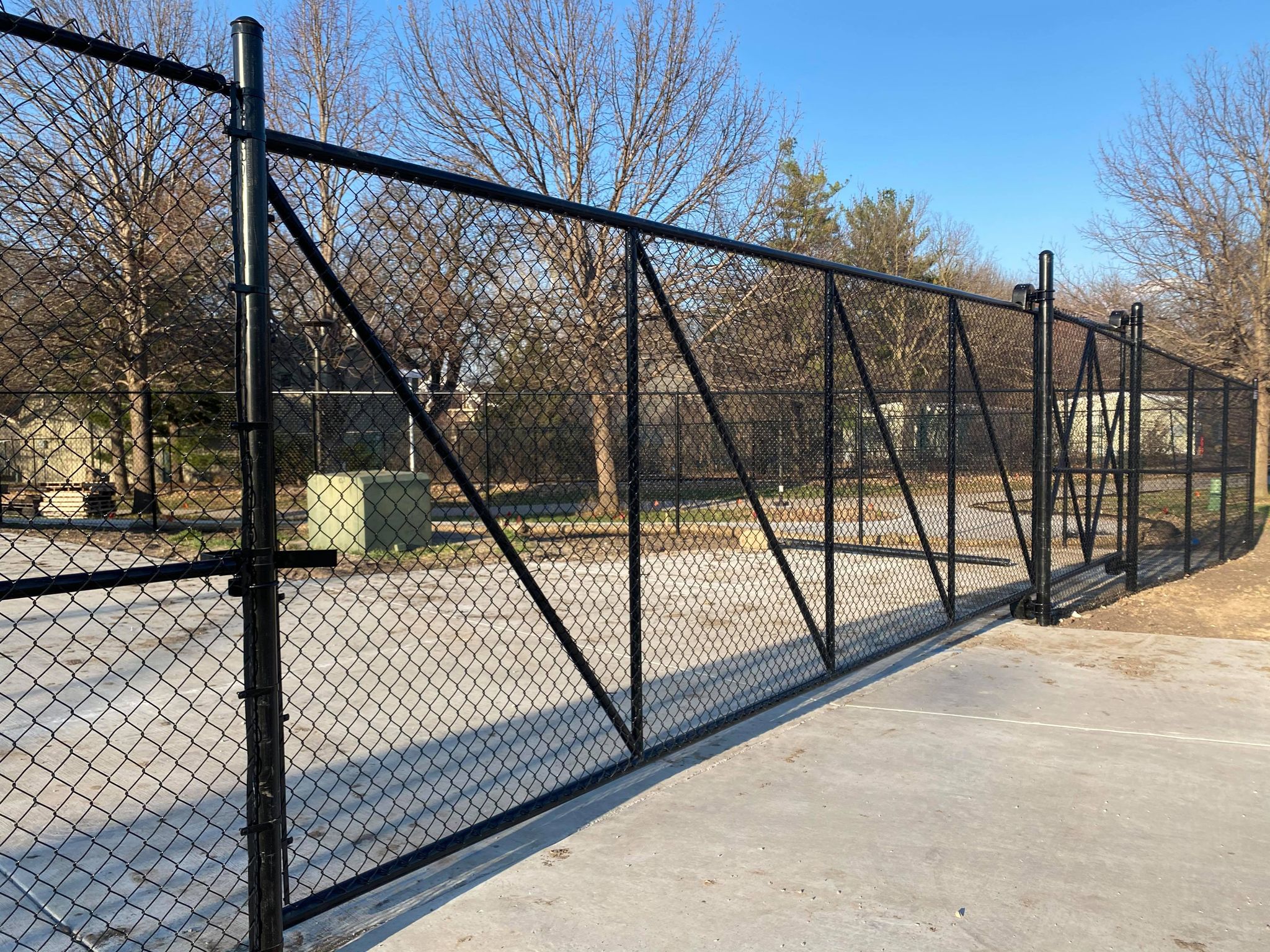 Black powder-coated commercial cantilever slide gate by Rio Fence Co Lincoln NE