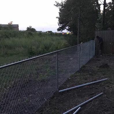 Residential galvanized chain-link fence installation in progress by Rio Fence Co in Lincoln NE