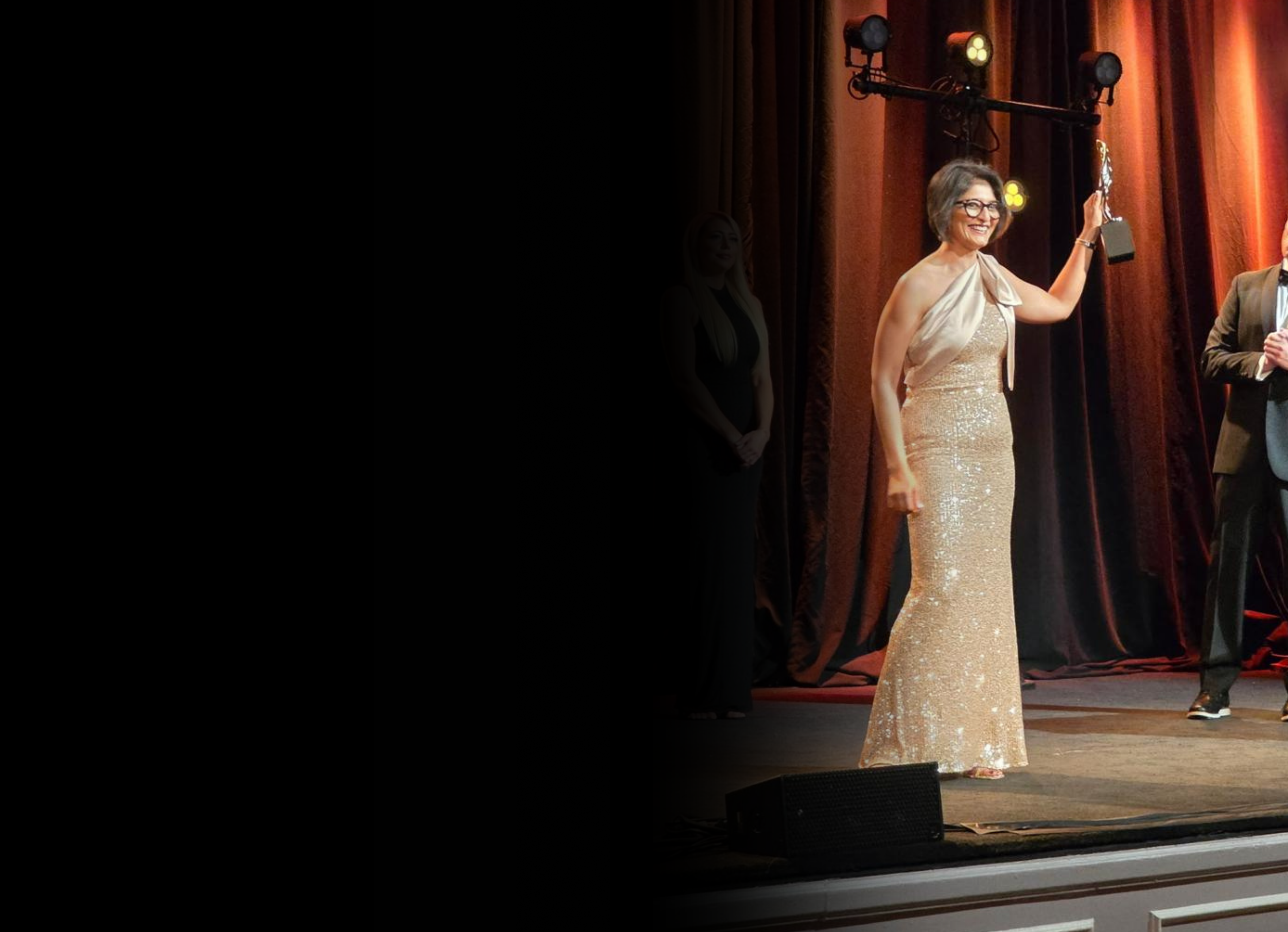 Anagha Deshmukh receiving an award on stage